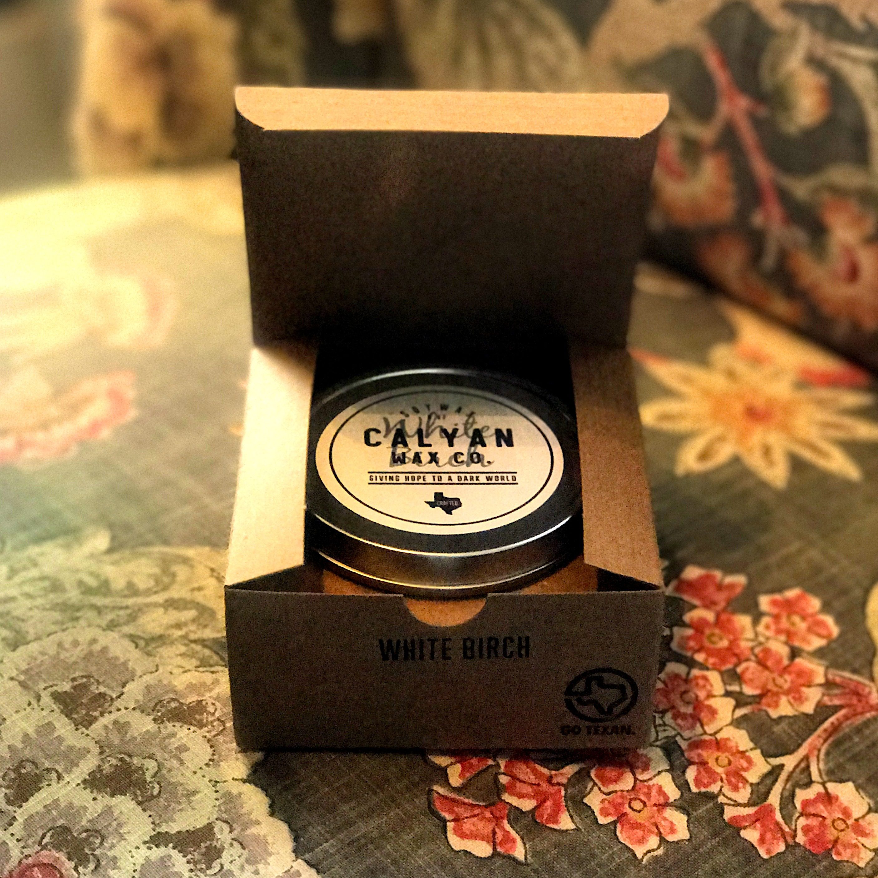 Photo of single boxed Calyan Wax Co. soy candle